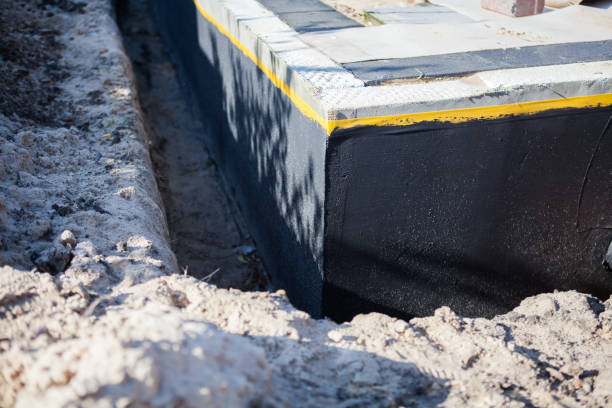 Professional Waterproofing technician working in Niagara Falls, NY